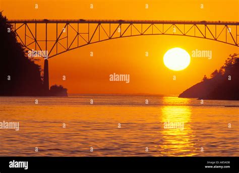 Sunset behind Deception Pass Bridge Deception Pass State Park Washington Stock Photo - Alamy