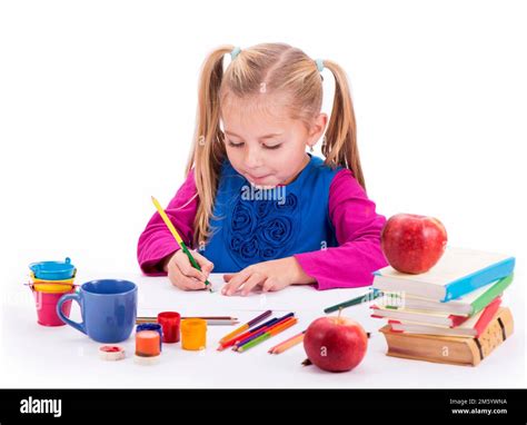 Children's hobbies, creativity, a little girl in a blue dress draws paints Stock Photo - Alamy