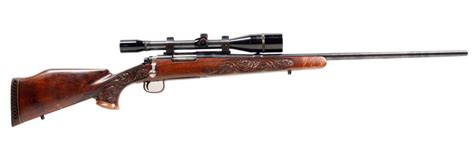 Remington Mdl 722 Cal .244 Rem SN:374157 Bolt action hunting rifle. Blued finish, Beautifully carved