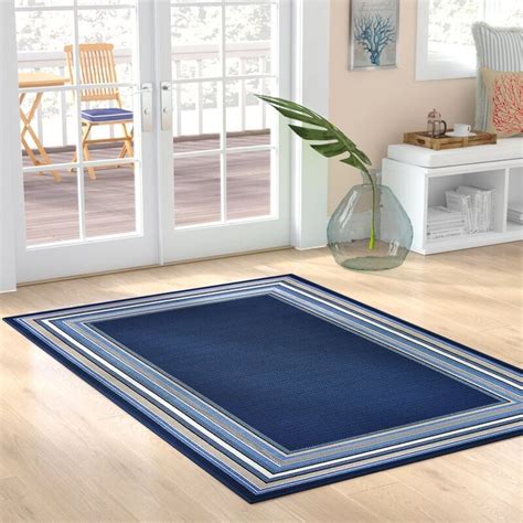 Hadiya Geometric Navy Blue Area Rug in 2020 | Area rugs, Nautical area rugs, Beach rugs