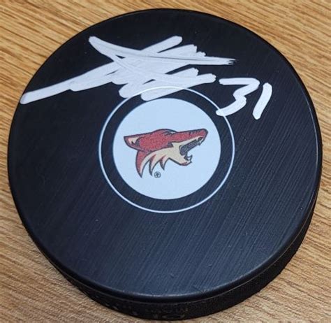 Autographed ADIN HILL Arizona Coyotes Hockey Puck - Main Line Autographs