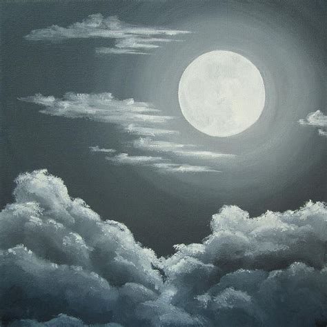 the full moon shines brightly above clouds