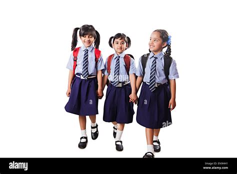 3 indian kids friends School Student walking Stock Photo - Alamy