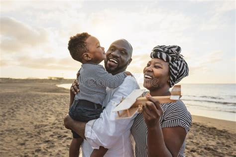 Happy African Family Having Fun on the Beach during Summer Vacation Stock Photo - Image of ...