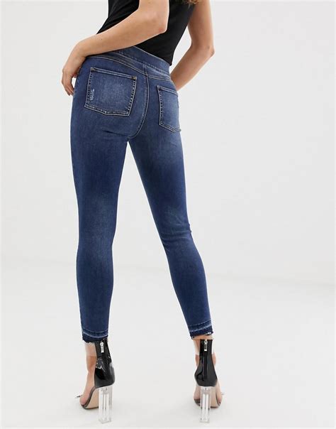 Spanx Denim Shape And Lift Distressed Skinny Jeans in Blue - Lyst