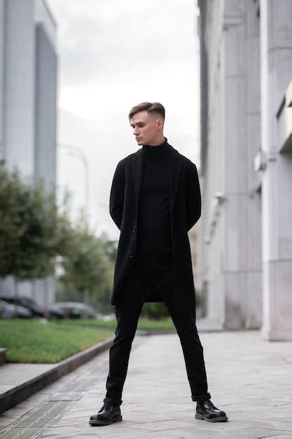 Premium Photo | Young attractive man in stylish black clothes on the ...