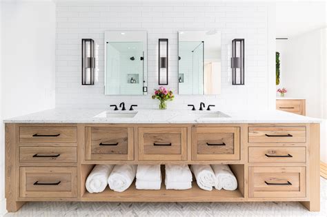 This bathroom features stunning white oak vanity cabinetry. The wood ...