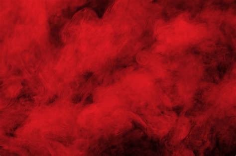 Premium Photo | Abstract red smoke on black background.