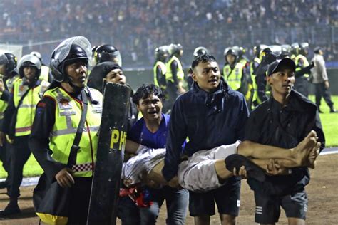 Stampede triggered by tear gas leaves 125 dead after Indonesia soccer match