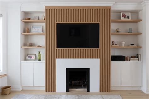 The Wood Slat Accent Of This Living Room Wall Is Perfectly Designed To Surround The TV And Fireplace