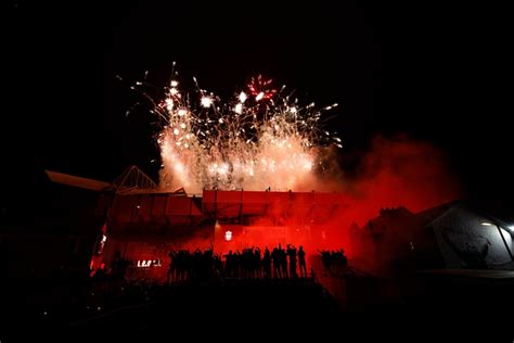 Liverpool fans let off fireworks outside Anfield to celebrate Premier ...