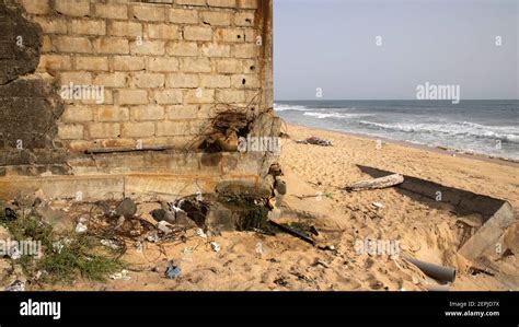 Monrovia Liberia Atlantic ocean beach trash pollution. Extreme poverty and hunger. Pollution and ...