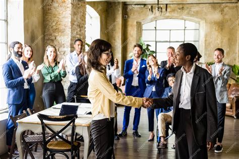 Premium Photo | Handshake between two business women to agree on the transition of deliveries ...