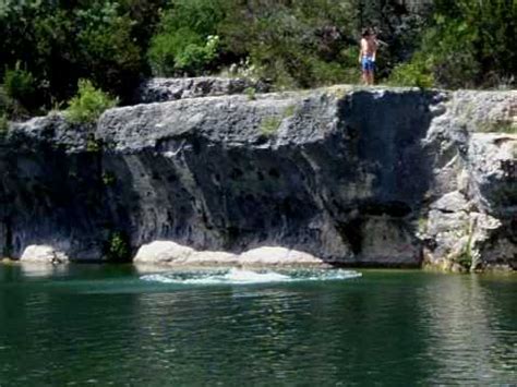 Billy jumping off cliff at Blue Hole Lake Georgetown - YouTube