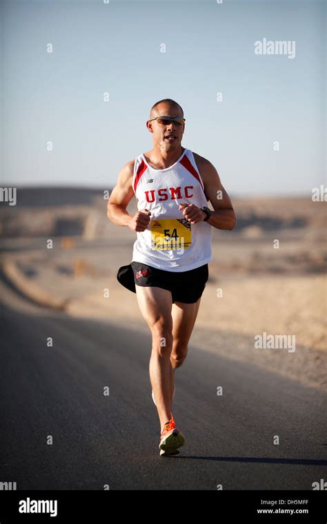 Capt. Pedro Rodriguez runs the 26.2 mile course of the Marine Corps ...