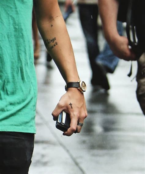 Harry Styles' Cross Tattoo on His Hand- PopStarTats