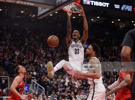 TORONTO, ON - NOVEMBER 23 - Brooklyn Nets forward Nic Claxton dunks ...