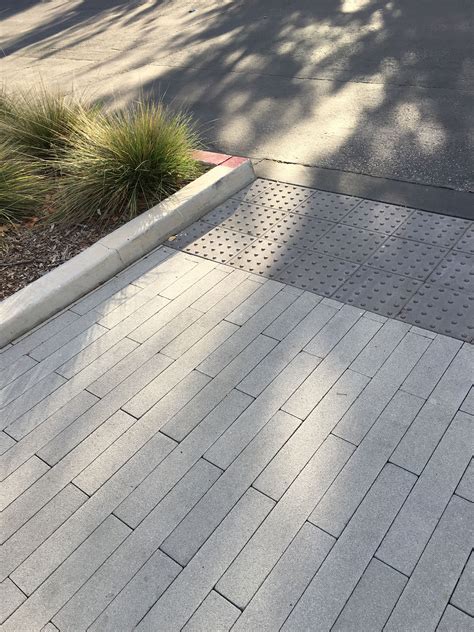 Modern driveway with 2-foot long vertical pavers | Garden paving ...