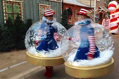 Inflatable Snow Globe Costumes Are A Hit At Rudolph's Holly Jolly™ Christmas Light Parade at ...