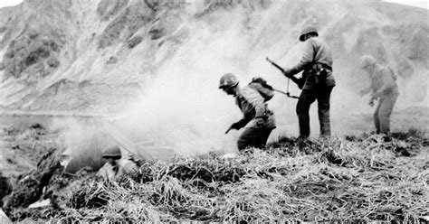 U.S. Army soldiers of the 7th Infantry Division closes in on heavily-defended Japanese positions ...