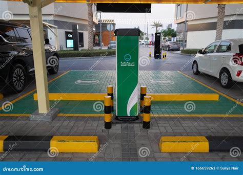 Smart Dubai Car Charging Stations in Parking Lot. Charging Modern ...