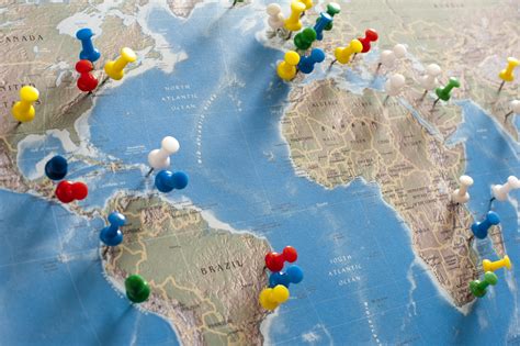 Free Image of Colorful Pins Locating Destinations on World Map | Freebie.Photography