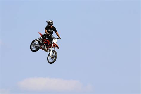 Dirt Bike Stunts - In The Air Photograph by Debbie Oppermann - Fine Art America