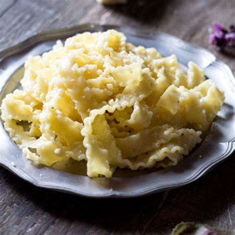 Mafalde pasta (pasta ribbons) with butter, black pepper and parmesan. A big bowl of cheesy ...