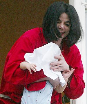 Cool Pictures: michael jackson dangling baby