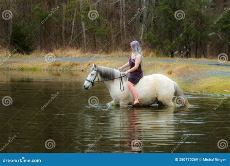 Young Woman with White Hair and Her Horse in the Water Go through Water ...