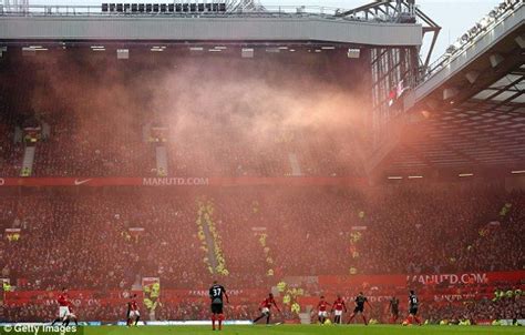 Liverpool fans set off a flair during the match | Manchester united, Manchester united fans ...