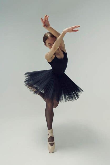 Premium Photo | Ballerina in a black tutu shows elements of ballet dance in motion