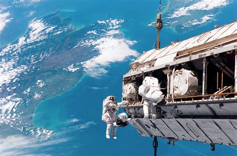 Astronauts Performing Spacewalk Photograph by Nasa/science Photo Library