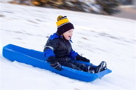 Little Boy's First Sled Ride Stock Photo - Image of winter, sledding: 7786998