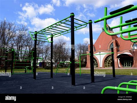 public outdoor exercise and sports park. green pull up bar and workout ...