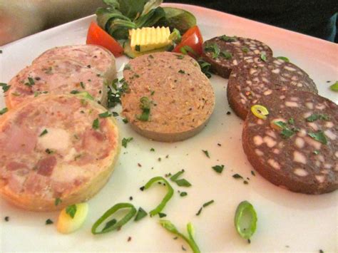 A plate of three different kinds of pre-cooked German sausages