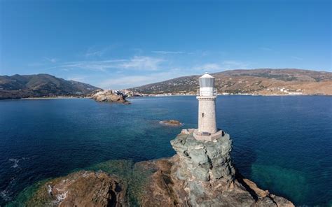 Premium Photo | Greece andros island the stone beacon on a rock aerial view chora town cape