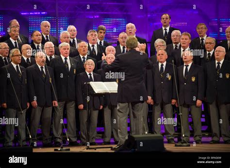 Male voice choir singing on stage in competition at the National ...