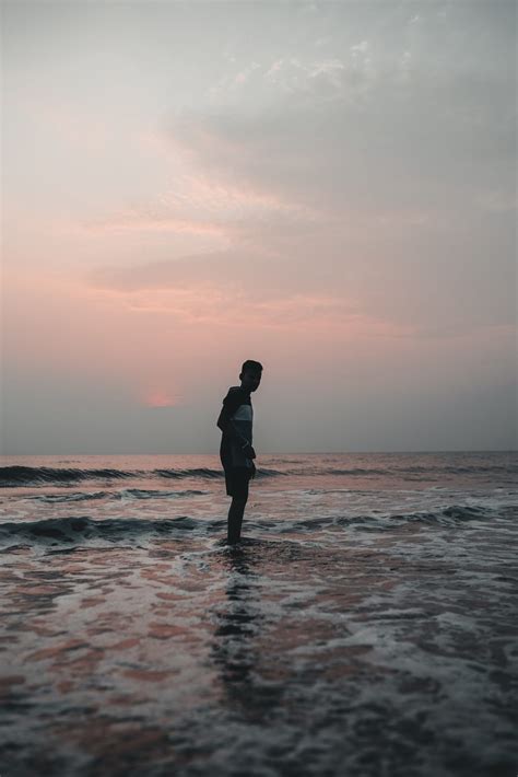 Man standing on a beach - PixaHive