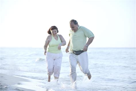 happy seniors couple on beach 12644279 Stock Photo at Vecteezy