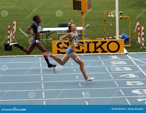 Athletes on the Finish of 400 Meters Race Editorial Image - Image of ...