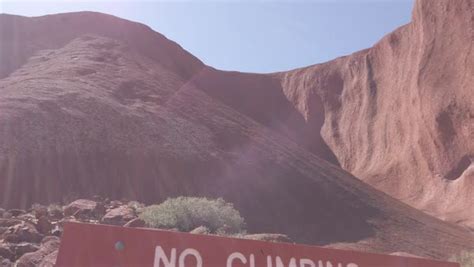 Uluru Base Walk no climbing sign in path of Uluru-Kata Tjuta National Park, Northern Territory ...