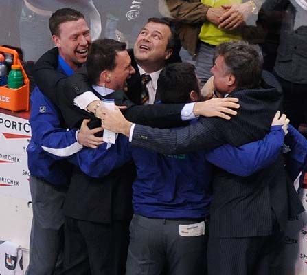 May 24, 2011: Canucks head coach Alain Vigneault (center), assistants ...