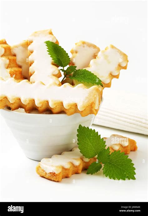 Vanilla cookies with white icing Stock Photo - Alamy