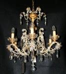 Gilt wood and crystal six arm antique chandelier