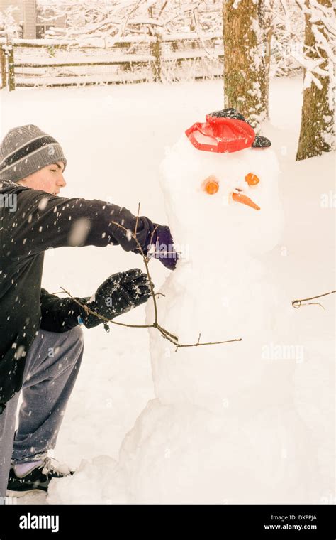 Building a Snowman Stock Photo - Alamy