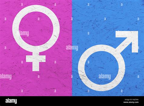 Male and female gender symbols (Mars and Venus signs) over pink and ...