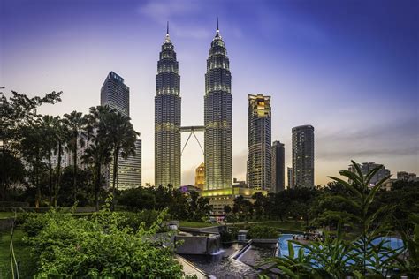 Kuala Lumpur KLCC Park Petronas Towers illuminated at sunset Malaysia - Travel Off Path