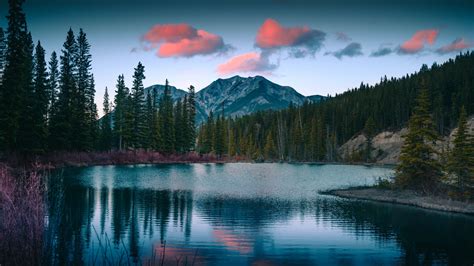 Download wallpaper 1366x768 mount lorette, pond, mountains, sunset, nature, tablet, laptop ...