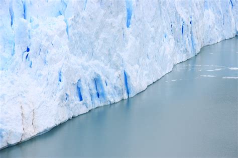 Glacier Ice Wall Meeting Water Surface · Free Stock Photo